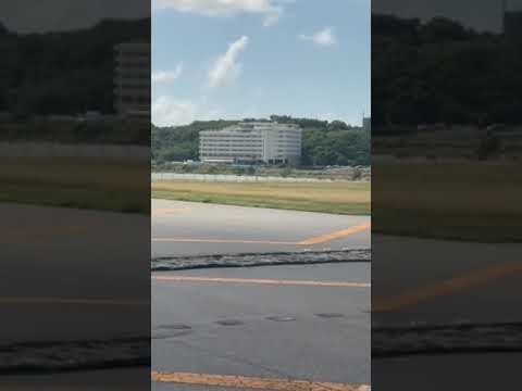 那覇空港の滑走路から見たSTORYLINE瀬長島