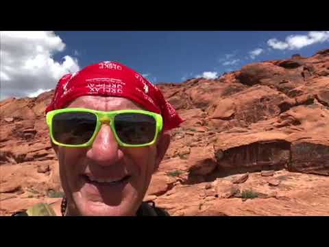 Medicine Man at Red Rock Canyon Nevada bare-footing and playing his Native American Flute for Mothe