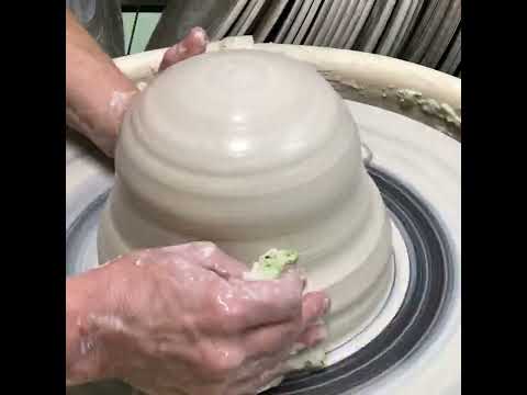 How to stack center large balls of clay on the potter’s wheel.