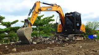 sany SY75c Mini Excavator cleaning and grading debris from previous Building