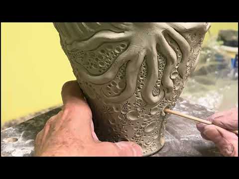 Texturing a wheel thrown and embellished pottery vase.