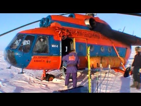 Unloading the material at the departure point - Geographic North Pole 2002 expedition