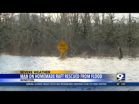 Man on homemade raft rescued after being swept up in swift-moving high river waters