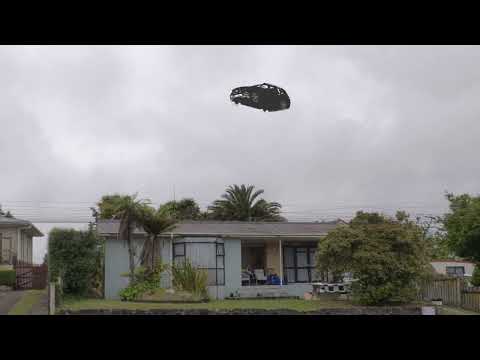 SUV sized drone seen hovering over house in broad daylight