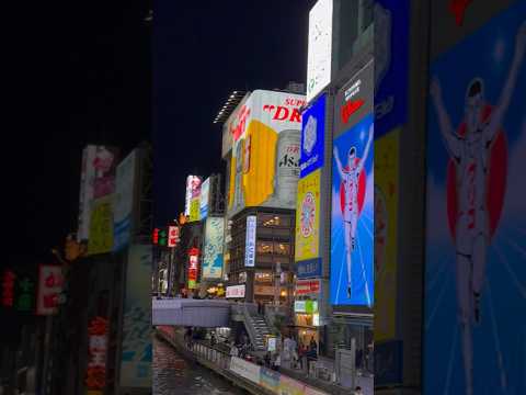 Glico Running Man, a giant illuminated sign for a snack company, is a famous sign of  Dotonbori!