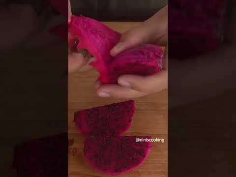 Cutting open Red & White Dragon fruits