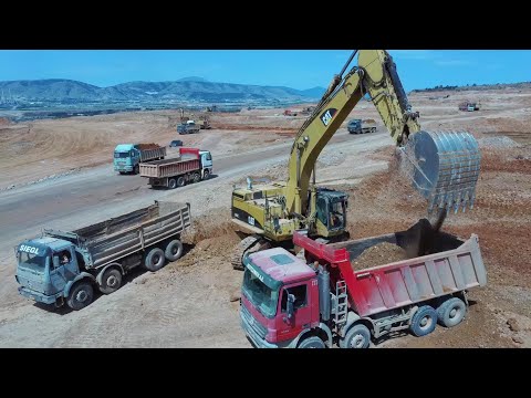 Caterpillar 365C Hydraulic Excavator Loading Mercedes And MAN 4 Axle Trucks - Aerial View