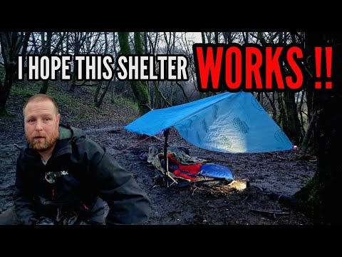 CAMPING IN RAIN under a self made shelter.