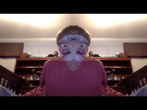 kid finds mirror effect on photo booth...