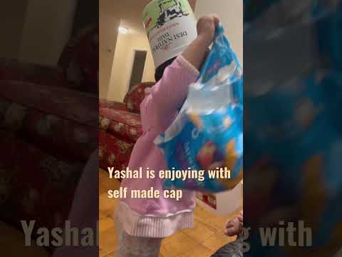 Yashal is enjoying with self made cap