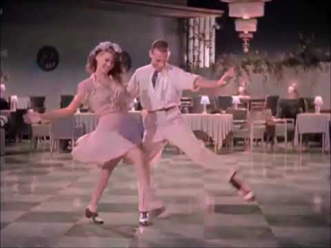 "Aos Pés da Santa Cruz". Dançarinos:  Rita Hayworth e Fred Astaire.