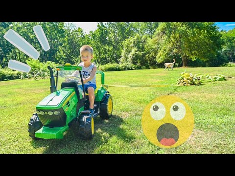 Pulling WHOLE Squash plants out of the garden with his TRACTOR.