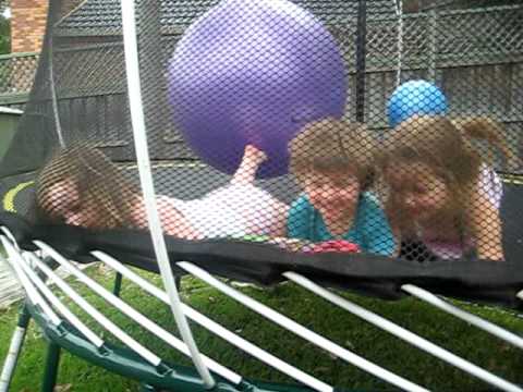 Rachel bounces the kids on the trampoline