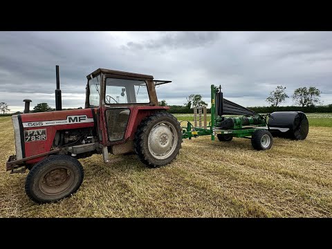 Massey 565 with a mc hale bale wrapper (full throttle)