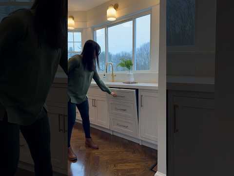 A seamless and sleek hidden dishwasher disguised as cabinets in our clients new kitchen.