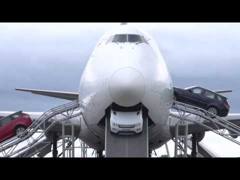 Range Rover Sport drives through a 747 plane