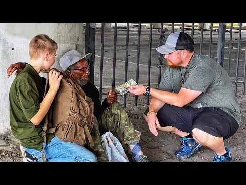 Young Child Selflessly Giving Food & Water To The Homeless