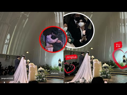 Close-up of Lee Jong Suk taking IU's hand to attend Lee Jong Suk's younger brother's wedding