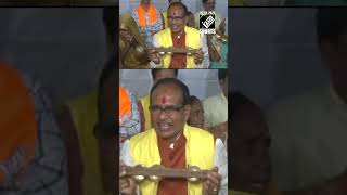 Former MP CM Shivraj Singh Chauhan dances with tribals during election campaign