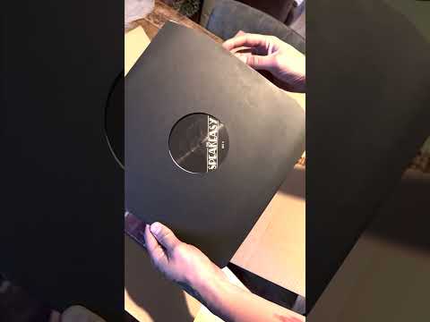 @LVDS opens his copy of The Speakeasy on vinyl