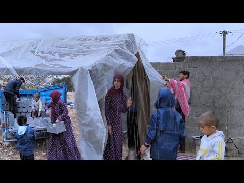 Heavy rain: Saadat and Parvin's efforts to prevent rain from entering the tent