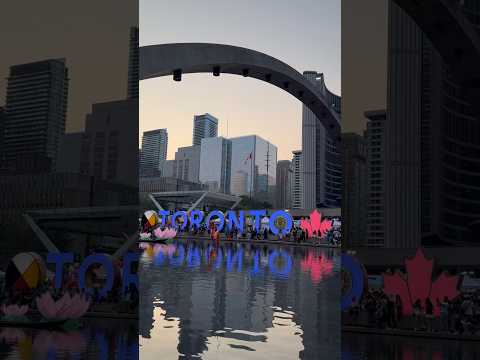 Iconic Toronto Sign with the striking New and Old City Halls at Nathan Phillips Square, Toronto!