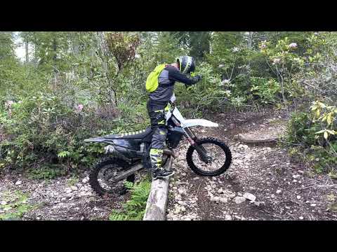 Boy Wonder parking his Husqvarna FX 350 on a log “on purpose” 🪵