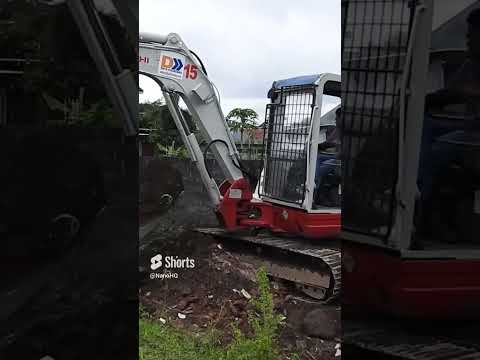 Mini excavator  takeuchi working moving dirt