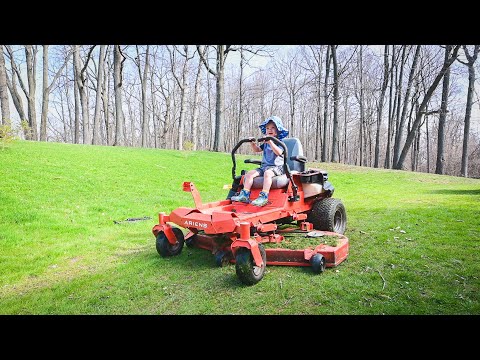 He drives the zero turn lawn mower! 2 years old helping dad mow the lawn