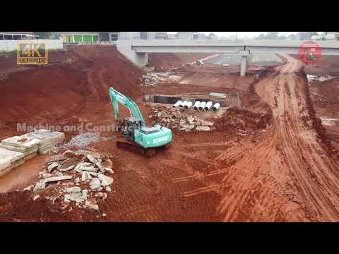 Drone Video! Kobelco SK200 Excavator Scraping Dirt and Support Drilling