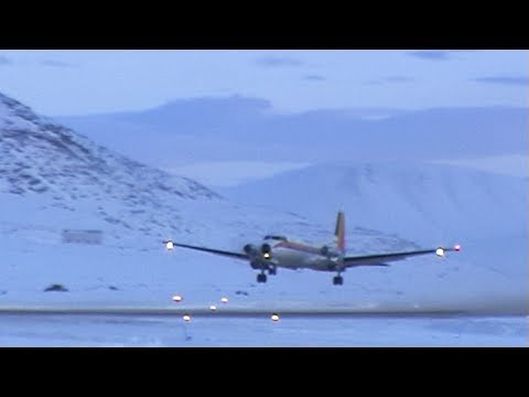 A plane taking off at sunset from Qikiqtarjuaq airport - Nanoq 2007 expedition