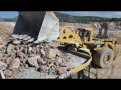 Caterpillar 994 Wheel Loader Loading Caterpillar 777F Dumpers - Samaras Mining Group - Drone Video