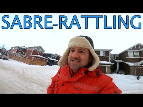 Meaning of SABRE-RATTLING in English