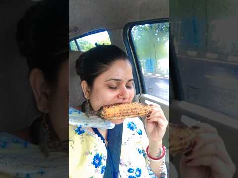 Loving the weather with corns 😜🌧️ #shorts #viralvideos #rain #driving #food #bhutta