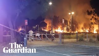 Firefighters rush to contain a fire on New Year's Eve at Tempe in Sydney