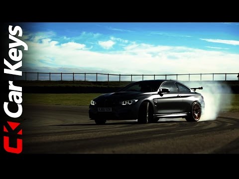 BMW M4 GTS drifts around a race circuit