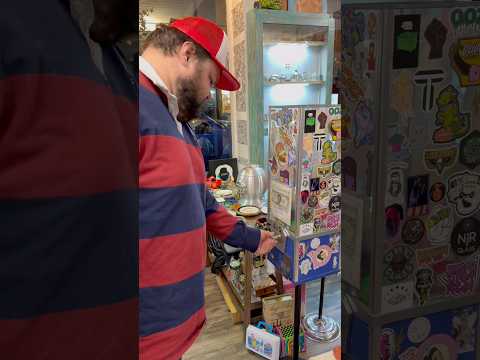 Customer returns and wins a new custom from the $20 gumball machine.