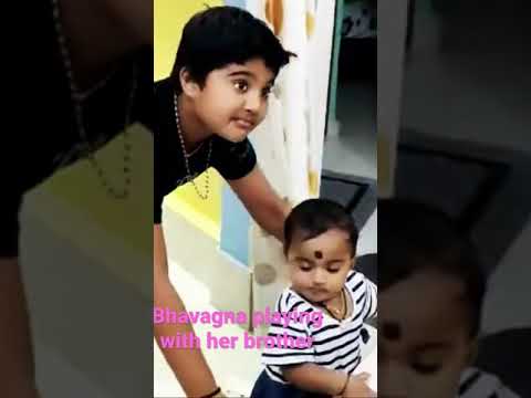 Bhavagna playing with her brother