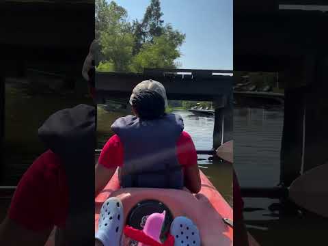 KAYAKING UNDER A DOCK