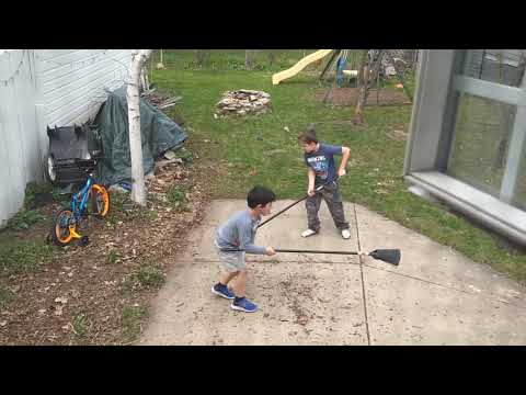 Wyatt & Jack cleaning up the backyard without being asked