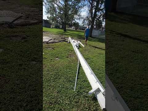 cleaning up an awning near the front entrance