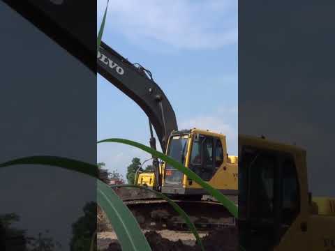 volvo excavator working on a pond project site