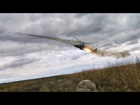 Ka-52 firing rockets and deploying Flares.