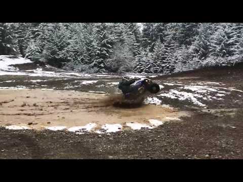 Raptor 700R in a mud hole with a wheelie exit!