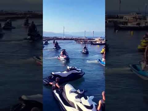 Look at how many jet skis there are ! A fleet of jet skis , A fleet of jet skis in the harbour