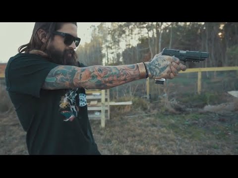 Slade shooting targets with his Agency Arms Sig P320