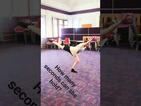 Dancer tests her balance in arabesque on plie #hold #balance #ballet #concentration