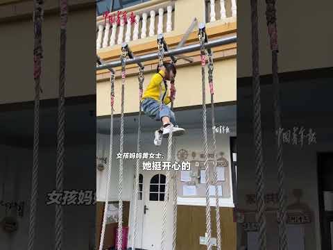 A girl participated in a climbing competition on kindergarten sports meeting and won first place