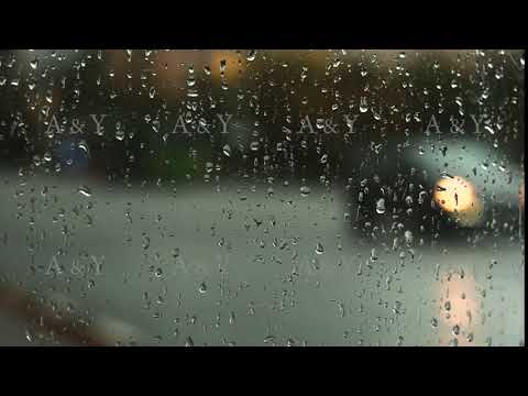 Car lights through wet glass.