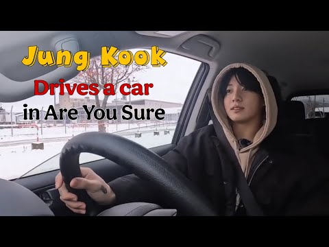 Jung Kook drives a car in Are You Sure